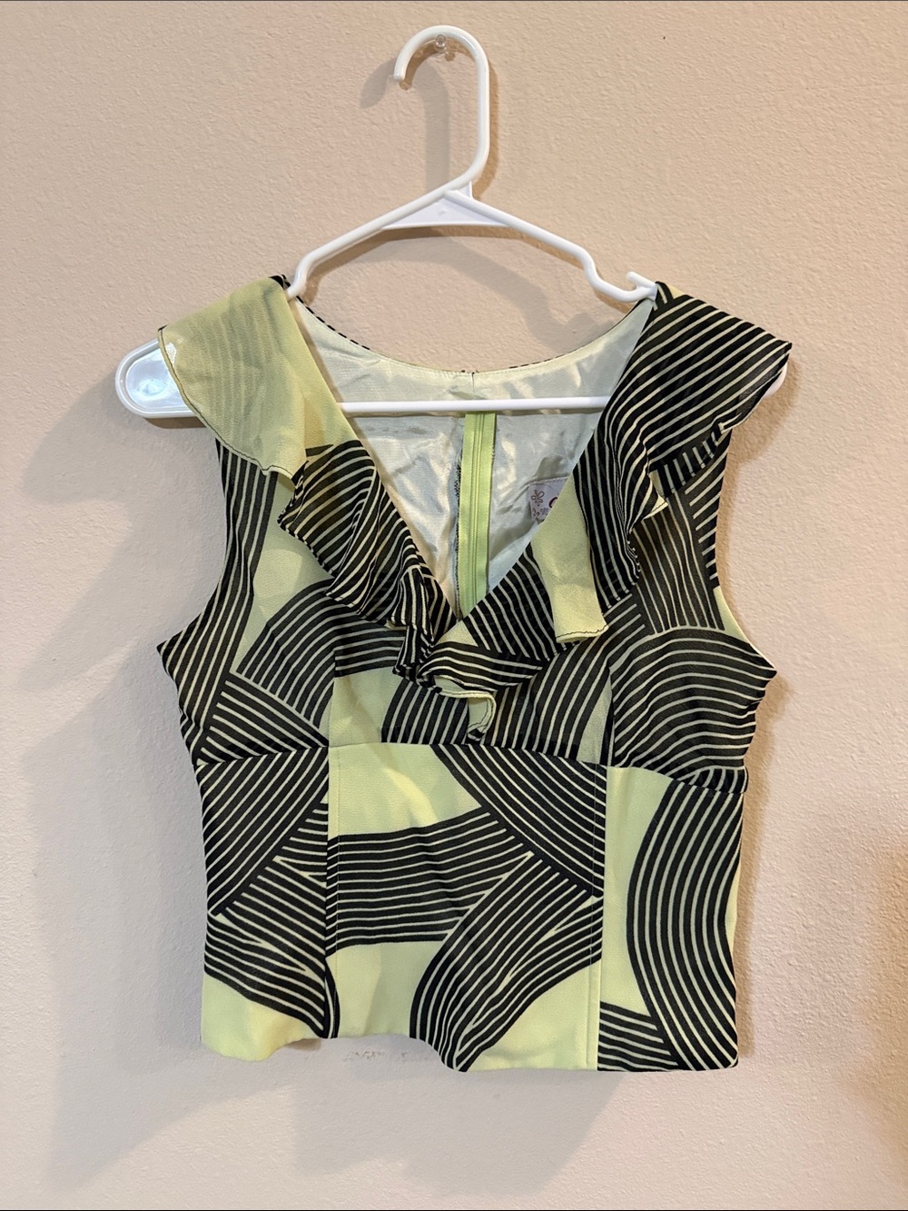 Sleeveless V-Neck Ruffle Blouse in Lime and Black Geometric
